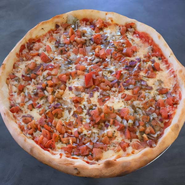 A whole Village Pizza & Cafe pizza, topped with diced tomatoes, onions, and cheese.